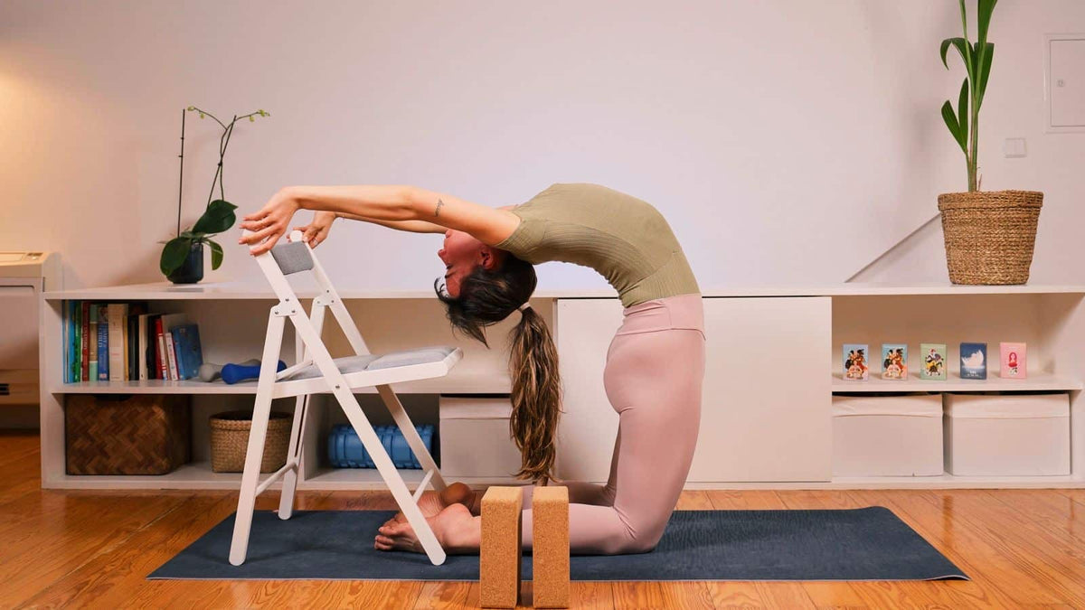 Grecia teaching a chair-supported backbend