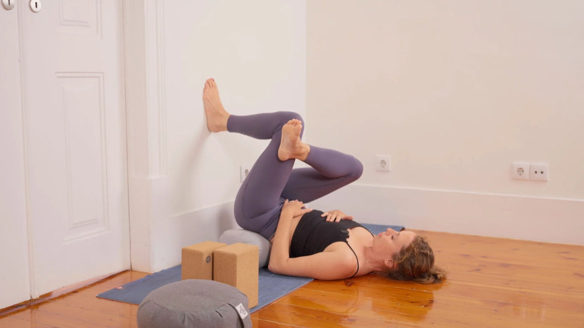 A restorative pose supported by props