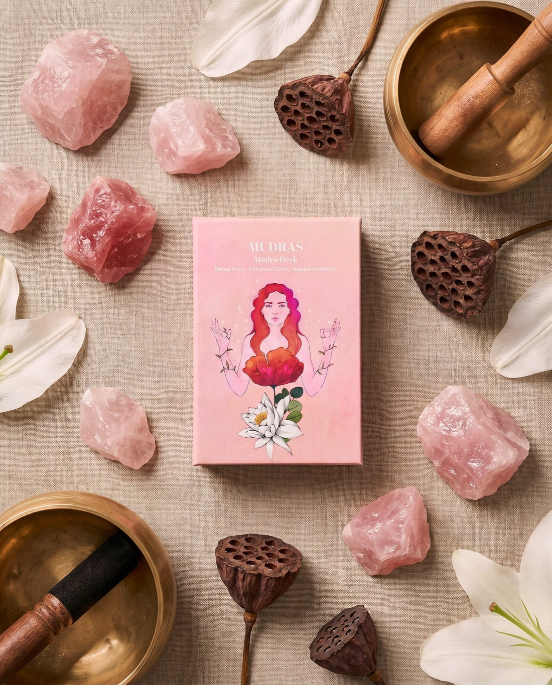 The box on linen with rose quartz, lotus pods and singing bowls