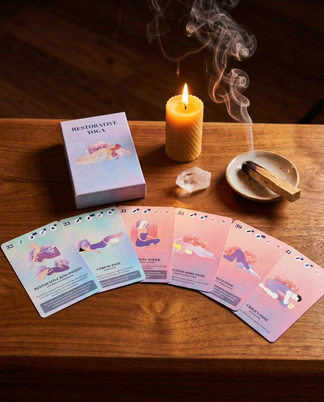 The deck and cards on a wooden table with candle and palo santo